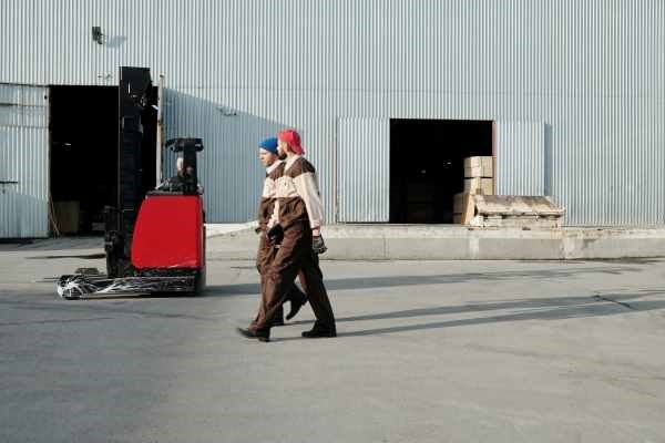 triple-e-training-will-abet-develop-my-employees-two-men-walking-in-front-of-warehouse