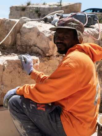 triple-e-training-workers-also-need-soft-skills-man-dismantling-stone-wall
