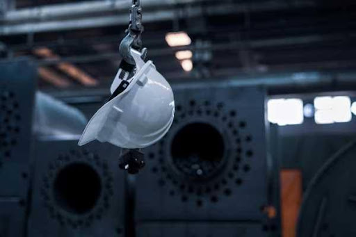 World class GETC AET qualification helmet hanging from hook