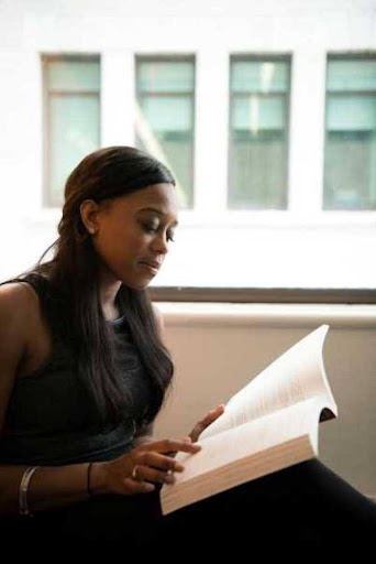 World class GETC AET qualification woman reading a book