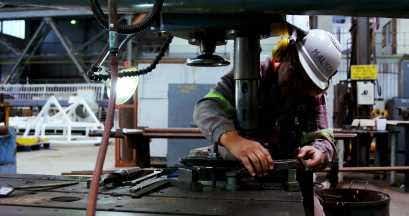 worker adjusting pipes