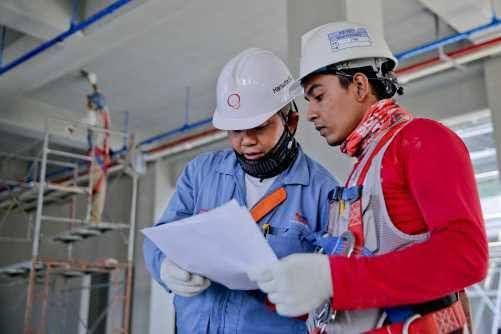 GETC: AET NQF 1 Workers reading a paper