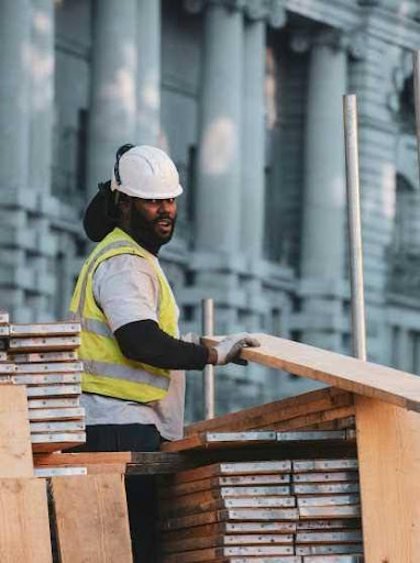 GETC: AET/ABET NQF 1 worker moving wood planks