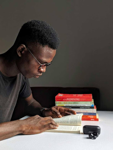 GETC AET NQF 1 LLC man reading books