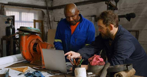GETC AET unlocking real potential two men working on laptop